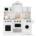 Classic white wooden pretend play kitchen set with stove, oven, microwave, sink, and cooking utensils