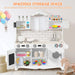 White wooden pretend play kitchen set with storage cabinets, toy food, dishes, and colorful building blocks