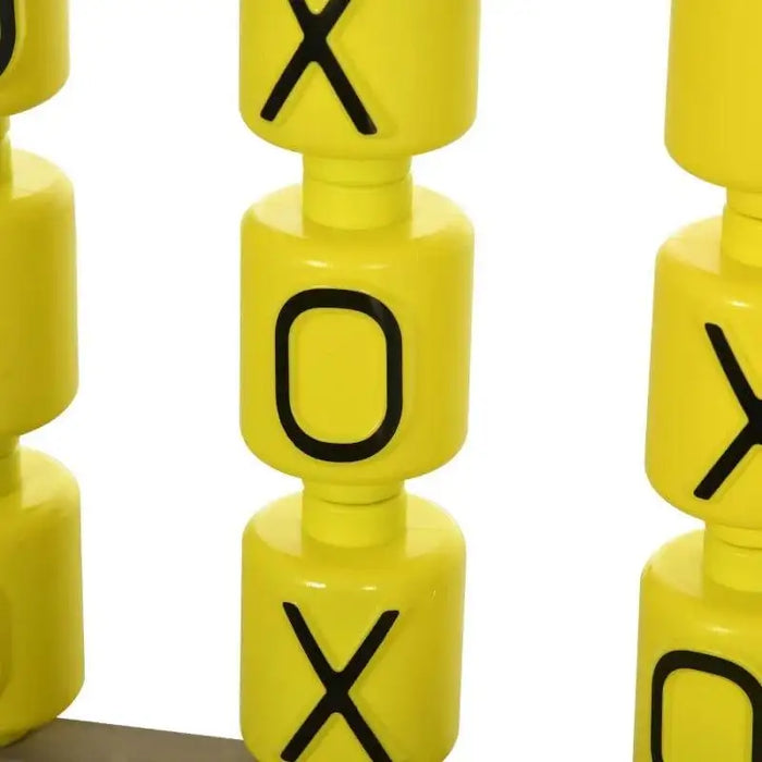 Close-up of yellow tic-tac-toe spinning blocks with black X and O letters