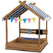 Kids wooden sandbox with house-shaped canopy, bunting flags, and play accessories