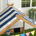 Kids wooden sandbox with blue striped canopy, garden playhouse design, and bunting flags