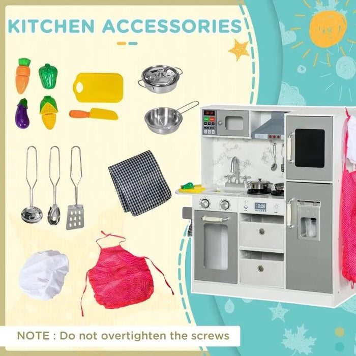 Kids wooden toy kitchen in white and silver with chef accessories, utensils, apron, and play food.