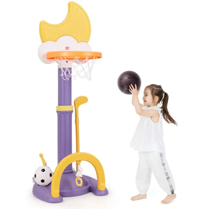 Child playing with a toy basketball hoop and ball on a white background