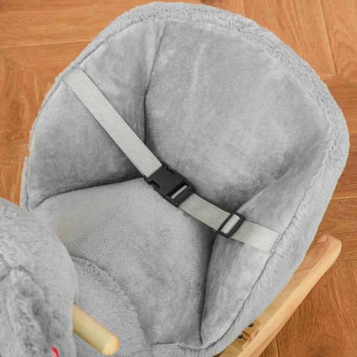 Soft grey koala rocker seat with safety harness on wooden floor