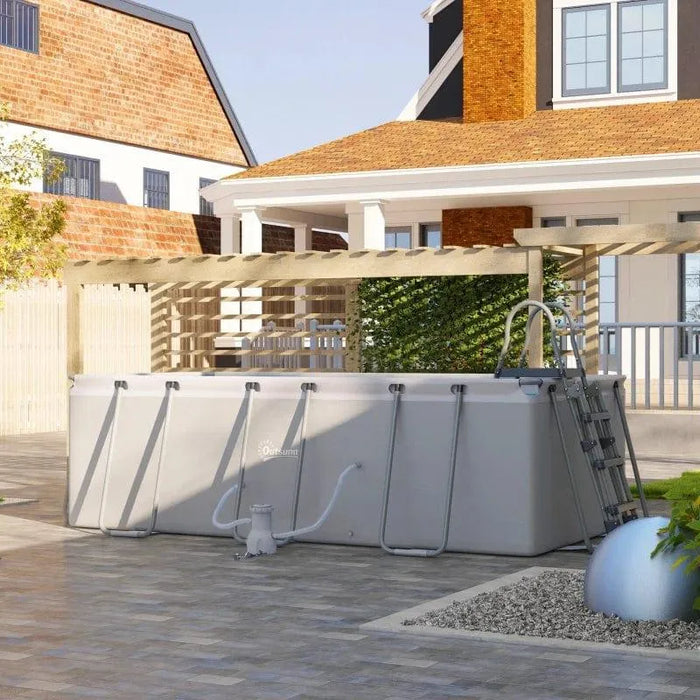 Large rectangular above ground swimming pool with steel frame, ladder, and filter pump in a modern backyard