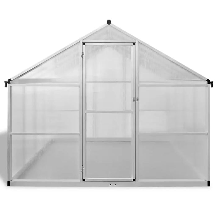 Large aluminium greenhouse with clear double-walled polycarbonate panels and door