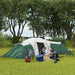 Large green camping tent with three rooms, family relaxing on grass, outdoor nature setting
