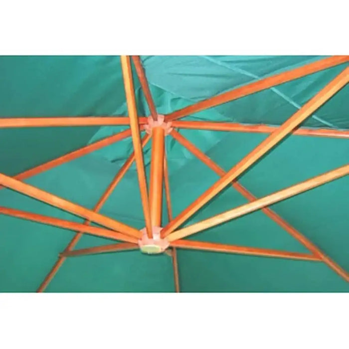Underside of large green parasol with wooden frame and support ribs.