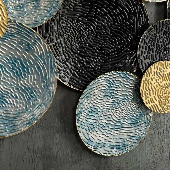 Set of round ceramic coasters with textured surfaces on a dark background