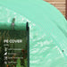 Close-up of green polytunnel PE cover showing zipper door, tomatoes, and feature icons.