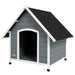 Large grey and black wooden dog kennel with slanted roof for outdoor pet housing