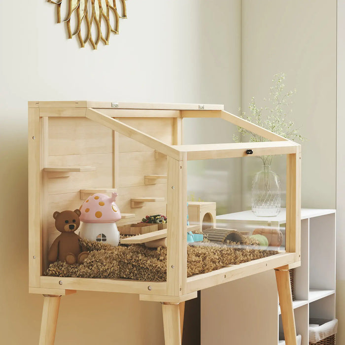 Wooden pet cage with toys inside, placed against a neutral wall.