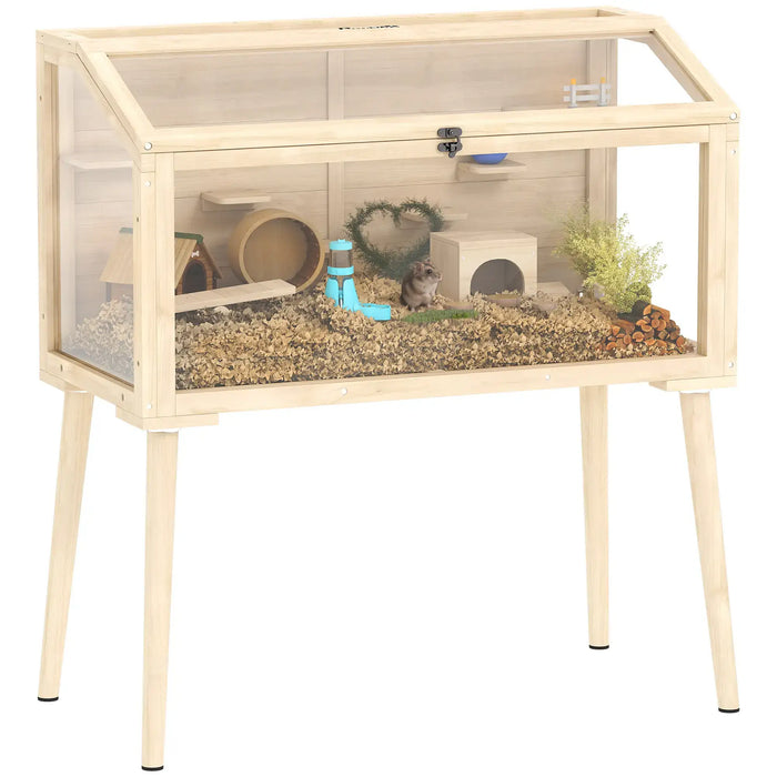 Pet cage with wooden frame and transparent sides, containing small plants and a toy.