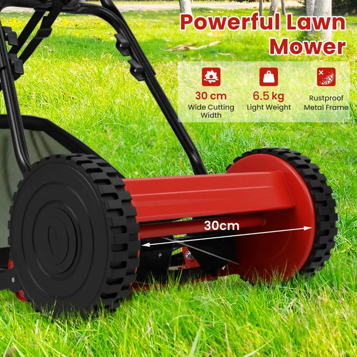 Red lawn mower on grass with features highlighted