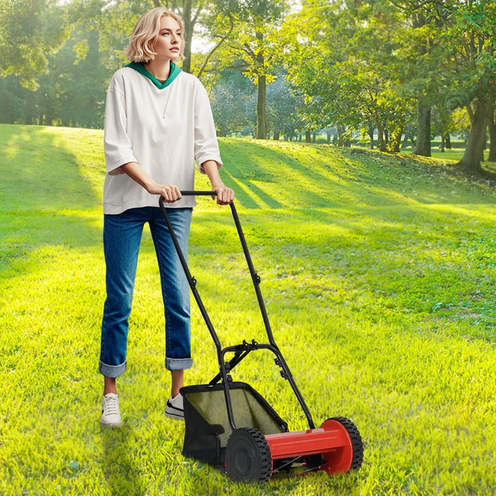 Woman using a lawn mower in a park