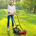 Woman using a lawn mower in a park