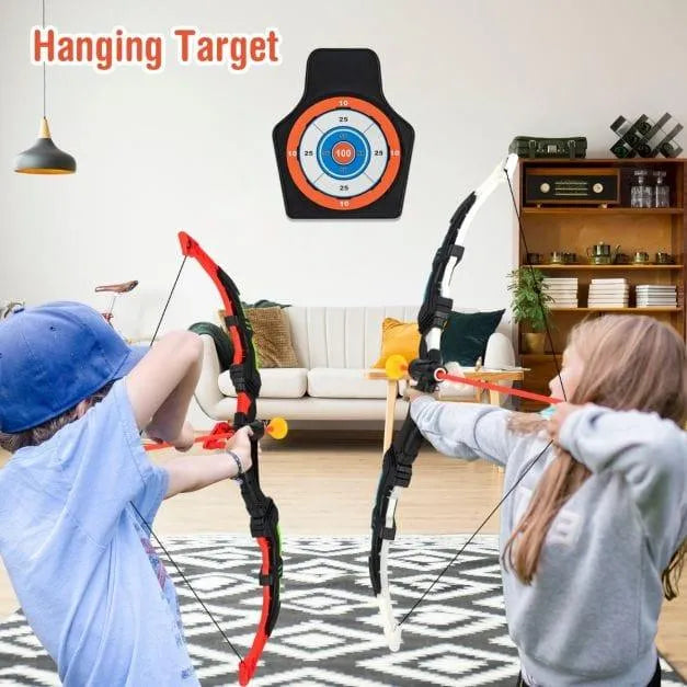Kids playing with LED archery set, aiming at suction target in living room