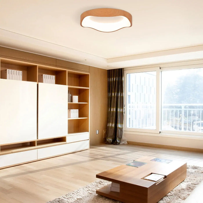 Modern living room with wooden furniture and large windows