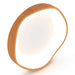 Round wooden lamp with a white light bulb on a white background