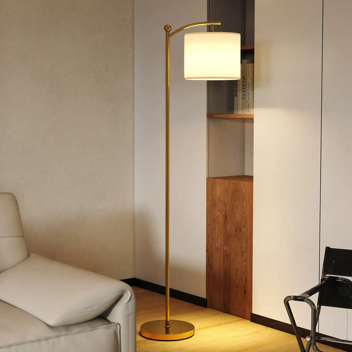 Gold and cream LED floor lamp with adjustable arm and fabric shade in modern living room