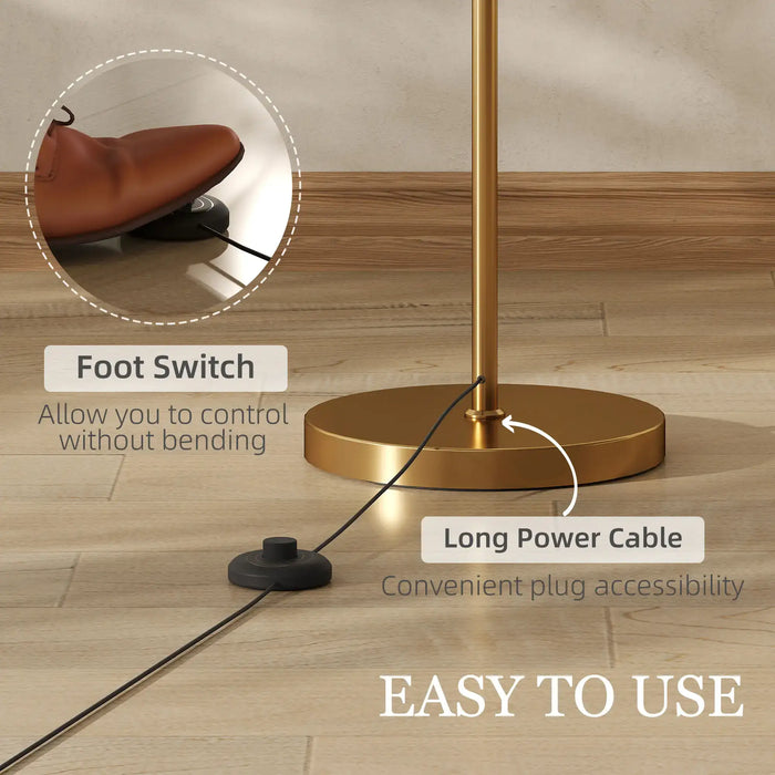 Gold floor lamp base with foot switch and long power cable on wooden floor