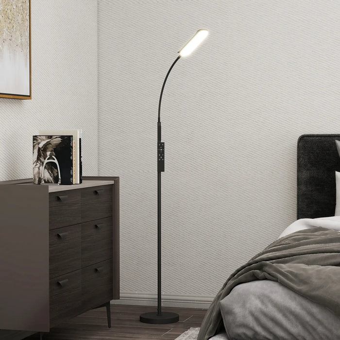Floor lamp in a bedroom setting with a bed and dresser.