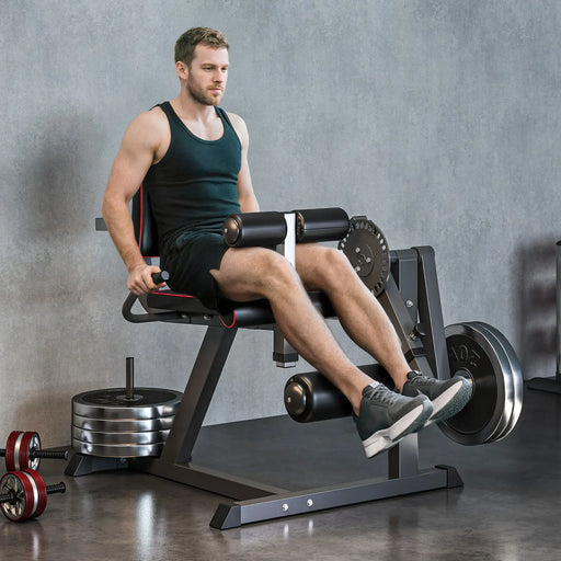 Man exercising on a leg press machine in a gym setting