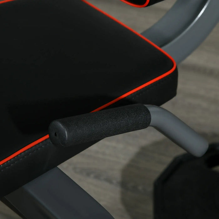 Close-up of a gym bench with black padding and gray metal frame.
