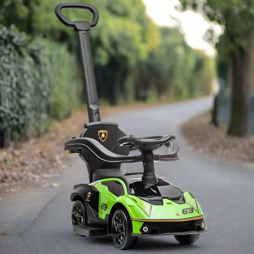 Green Essenza SCV12 ride-on car for toddlers with push handle, parked on outdoor path
