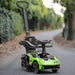 Green Essenza SCV12 ride-on car for toddlers with push handle, parked on outdoor path
