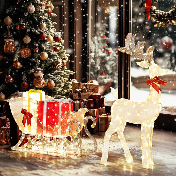 Decorative reindeer with a sleigh and Christmas tree in a festive setting