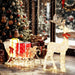 Decorative reindeer with a sleigh and Christmas tree in a festive setting