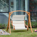 Outdoor teak and larch wood loveseat swing chair with canopy on lawn