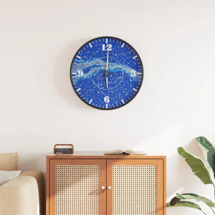 Blue wall clock with white starry galaxy design above wooden cabinet in modern living room