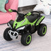 Green toddler ride-on quad bike with foot-to-floor design and racing decals indoors