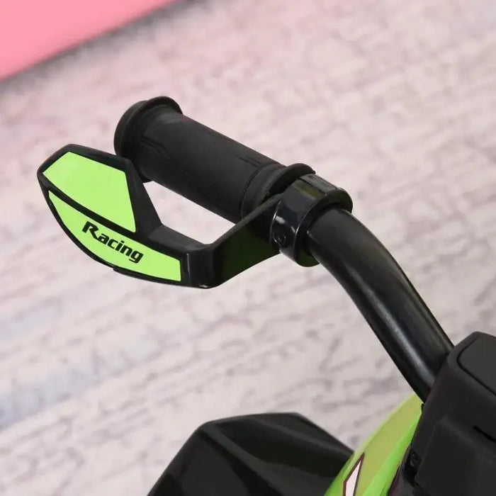 Green toddler quad bike handlebar with racing guard close-up on light background