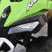 Green manual ride-on quad bike for toddlers with realistic headlight and black wheels