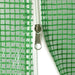 Close-up of green mesh greenhouse cover with white zipper and metal pull tab
