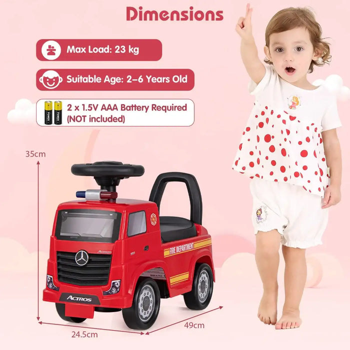Red toy fire truck with dimensions and a child for scale on a pink background