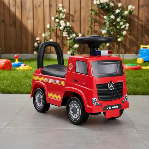 Red toy fire truck with Mercedes-Benz logo on a patio