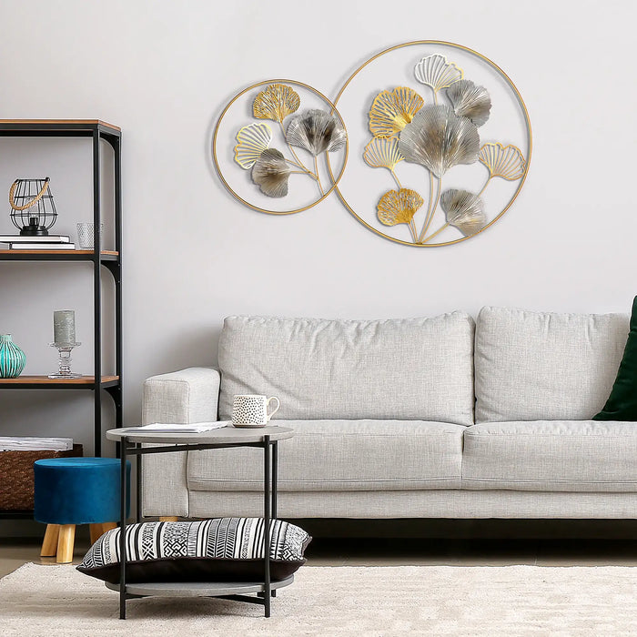 Living room with a gray sofa, decorative wall art, and a small table.