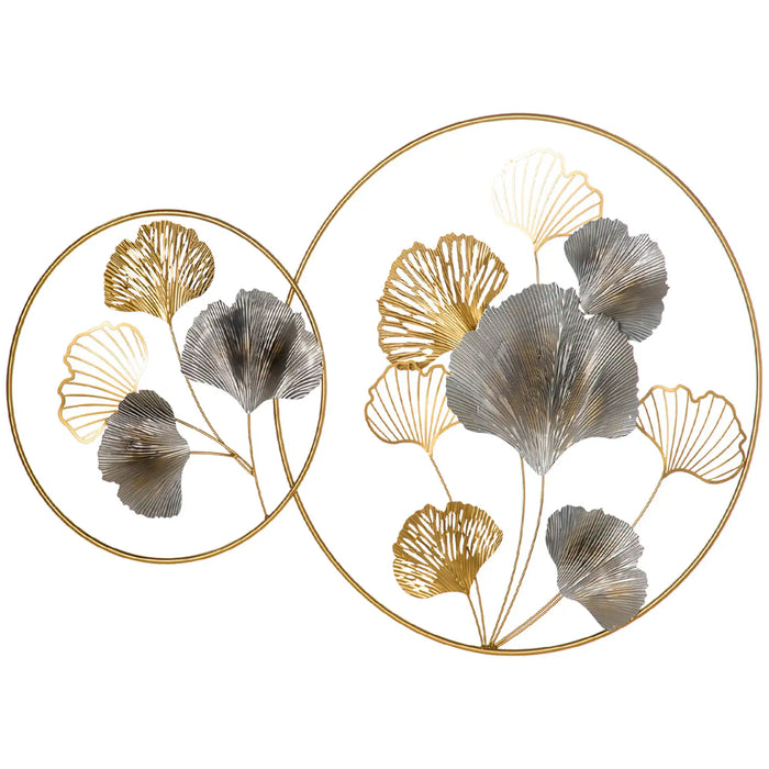 Decorative wall art with gold and silver leaf designs on a white background