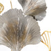 Decorative metallic leaves in gold and silver on a white background