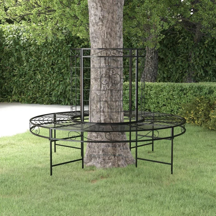 Black metal round tree bench with decorative wrap-around design in a garden setting