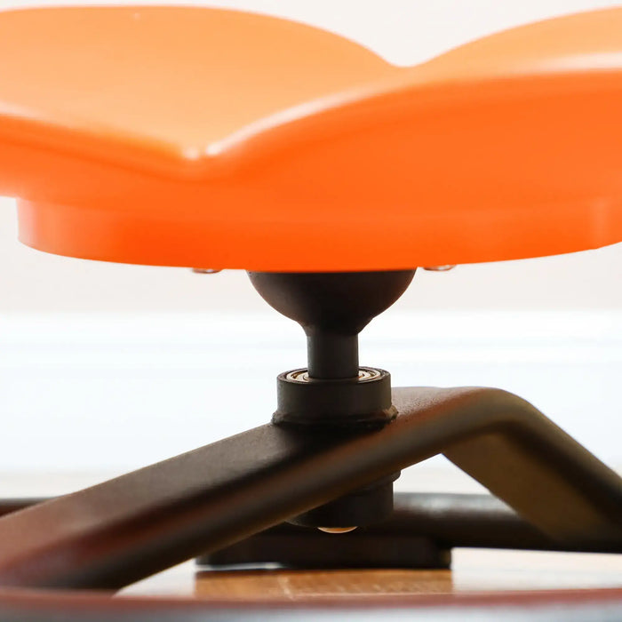 Close-up of an orange office chair seat on a white background