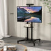 Modern black rolling TV stand with height adjustable mount for 32-70 inch screens, holding a widescreen TV displaying a mountain lake sunset