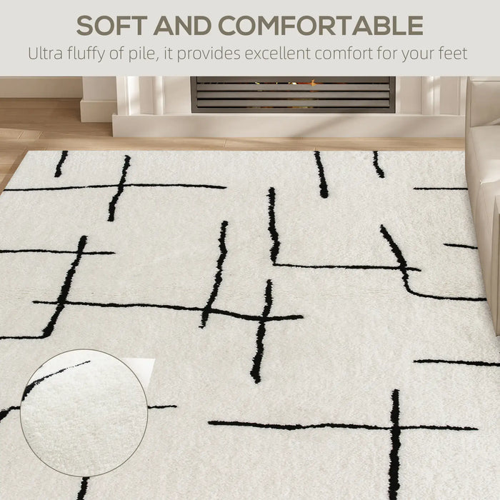 White rug with black abstract patterns in a room setting, emphasizing comfort.