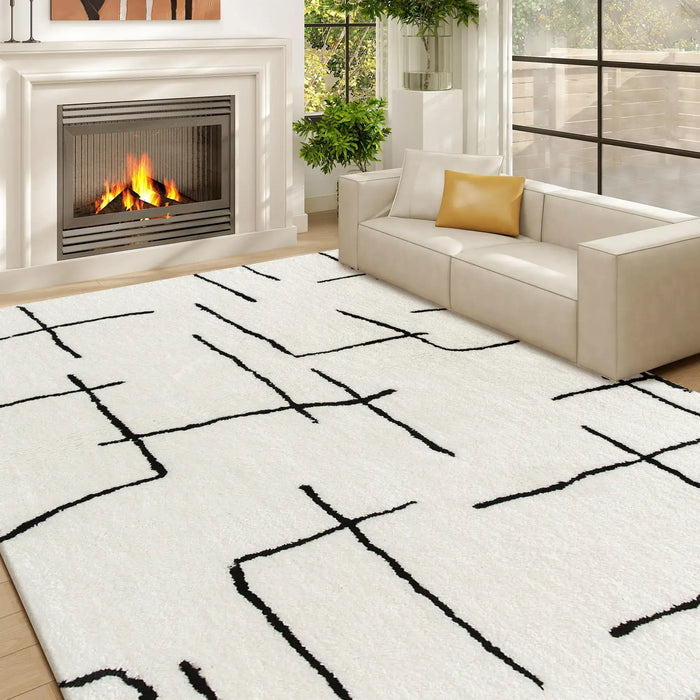 Modern living room with a white rug featuring black abstract patterns, a beige sofa, and a fireplace.