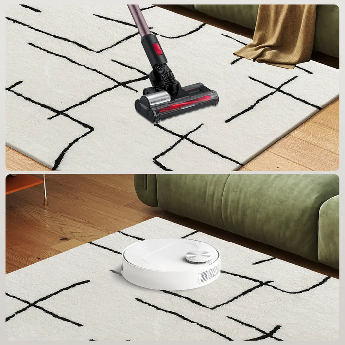 Vacuum cleaner and robot vacuum cleaning a rug in a living room setting.