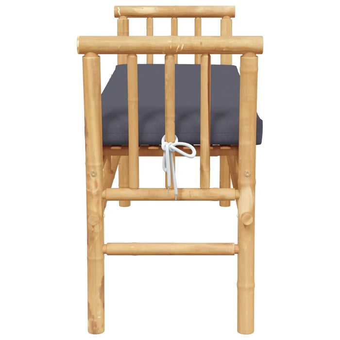 Modern bamboo garden bench with grey cushion tied at the back, natural outdoor seating
